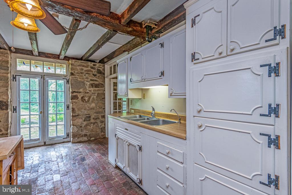 807 Holly Corner Road Fredericksburg, VA 22406 - Photo 30 of 57 a kitchen with cabinets and window