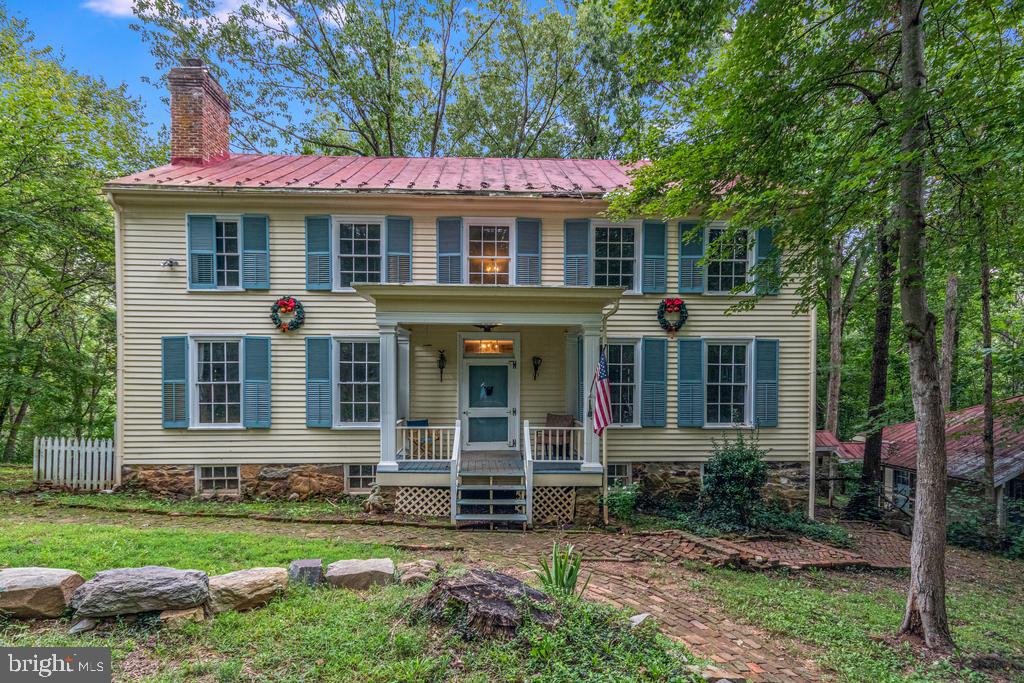 807 Holly Corner Road Fredericksburg, VA 22406 - Photo 4 of 57 a front view of a house with a yard