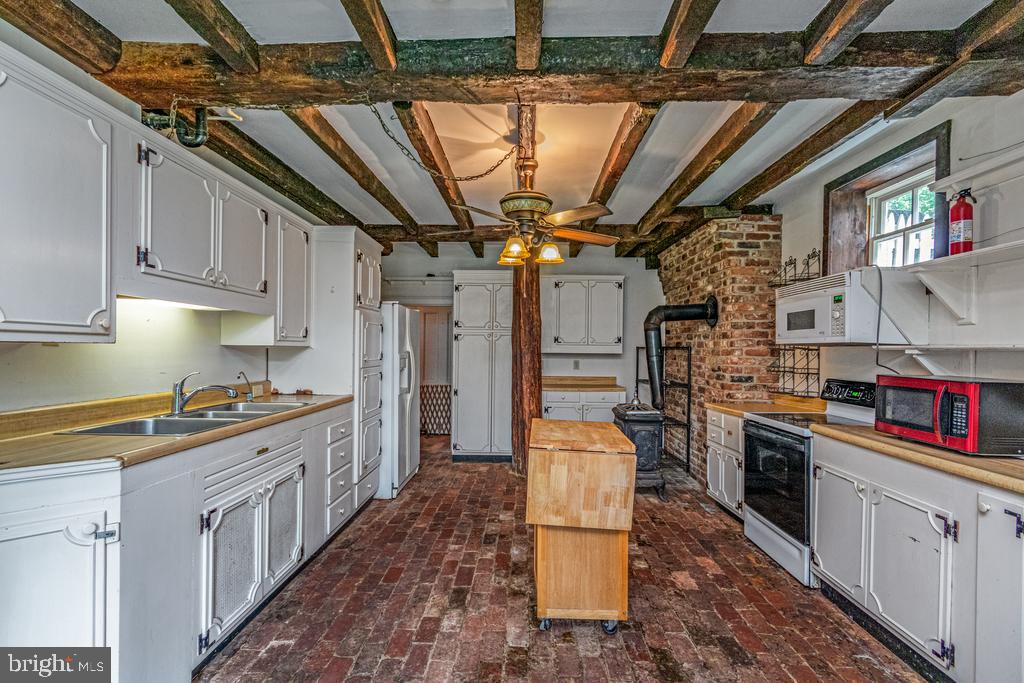 807 Holly Corner Road Fredericksburg, VA 22406 - Photo 31 of 57 a kitchen with stainless steel appliances granite countertop a stove a sink dishwasher and cabinets