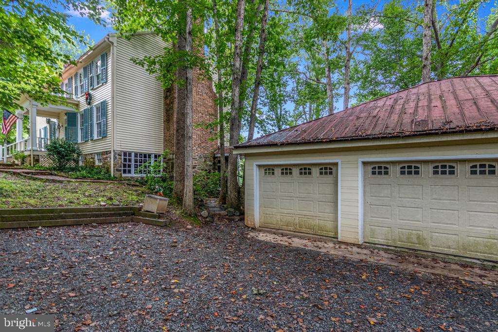807 Holly Corner Road Fredericksburg, VA 22406 - Photo 5 of 57 a front view of a house with a garden