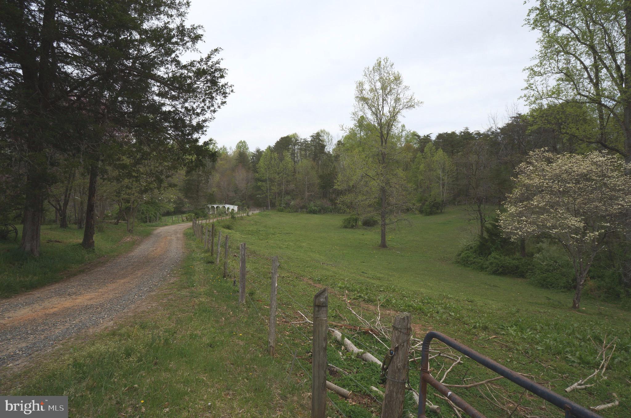 807 Holly Corner Road Fredericksburg, VA 22406 - Photo 42 of 57 a view of a field with trees in the background