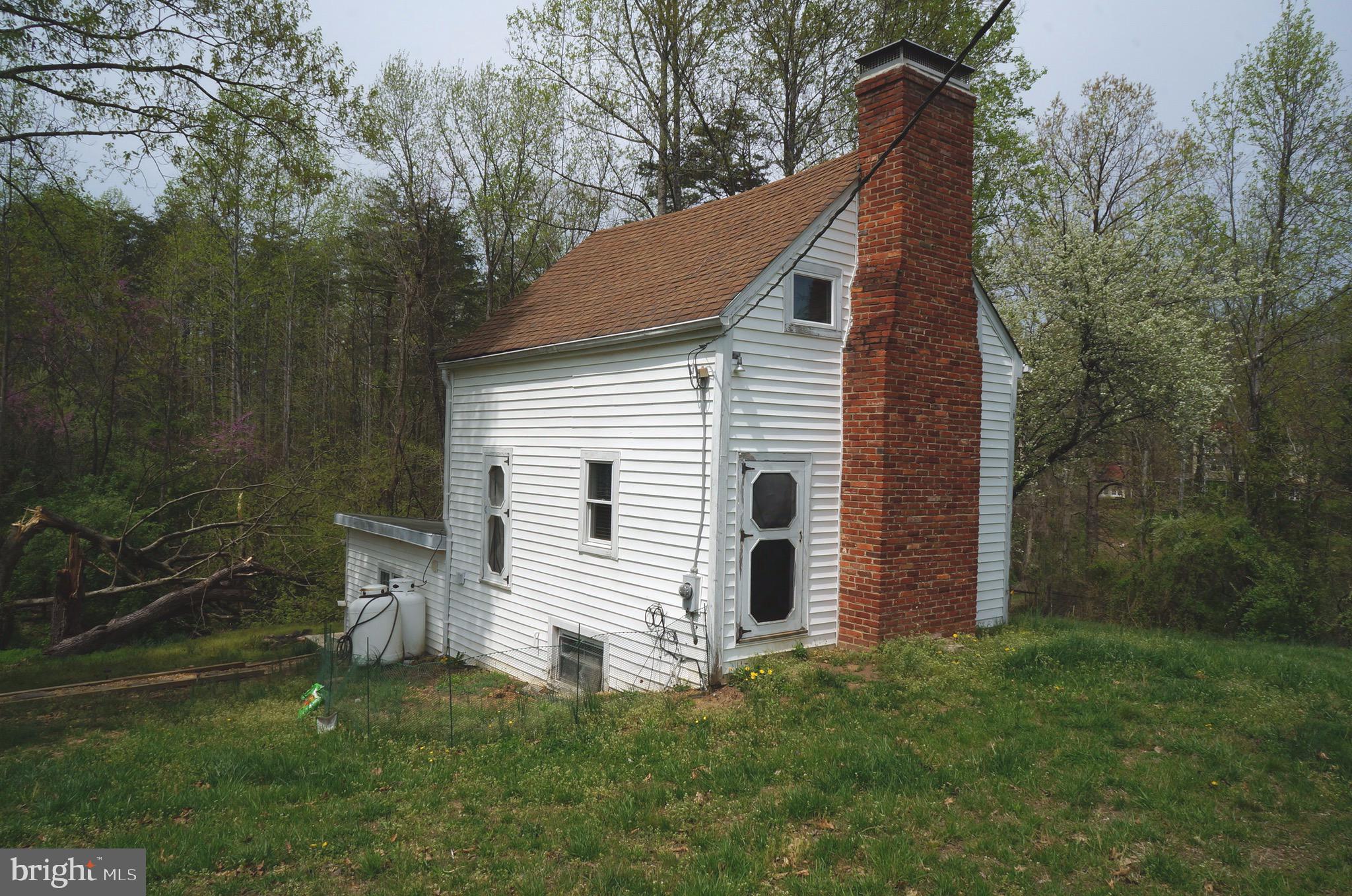 807 Holly Corner Road Fredericksburg, VA 22406 - Photo 45 of 57 a view of a house with a yard