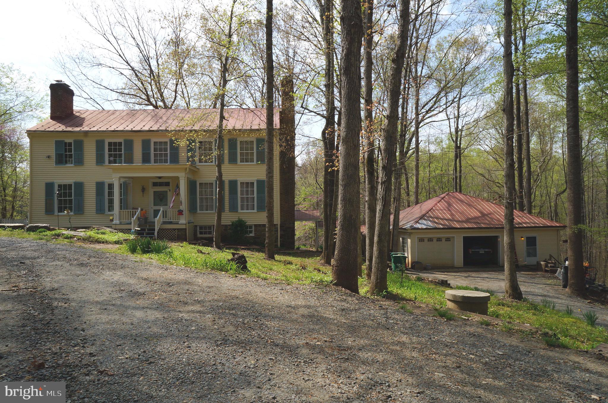 807 Holly Corner Road Fredericksburg, VA 22406 - Photo 7 of 57 a front view of a house with a yard and trees