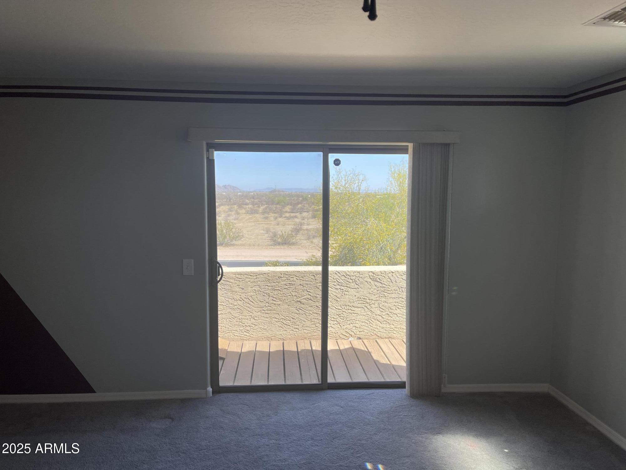 51355 West Century Road Maricopa, AZ 85139 - Photo 12 of 33 a view of an empty room and a window