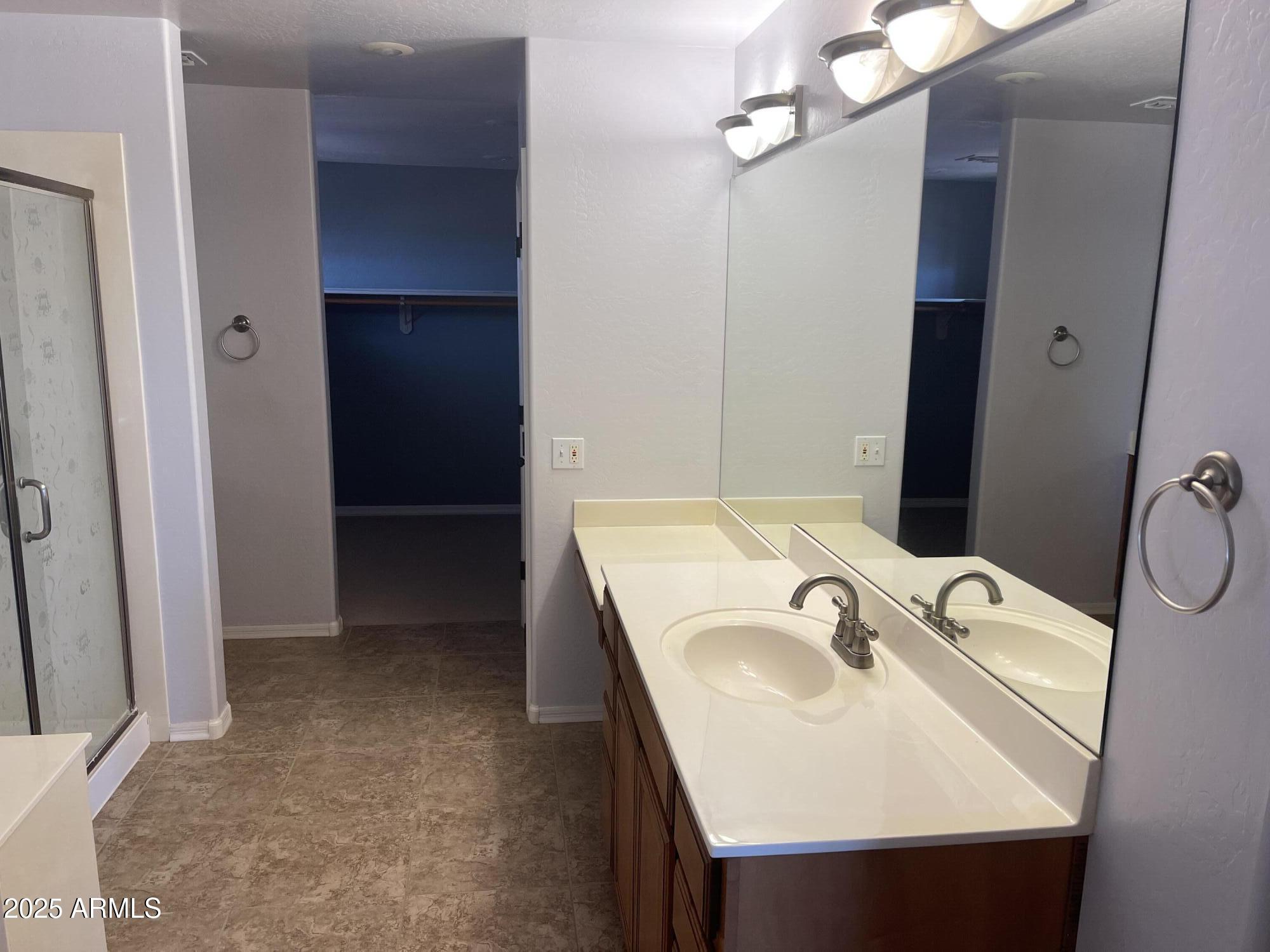 51355 West Century Road Maricopa, AZ 85139 - Photo 14 of 33 a bathroom with a sink and mirror