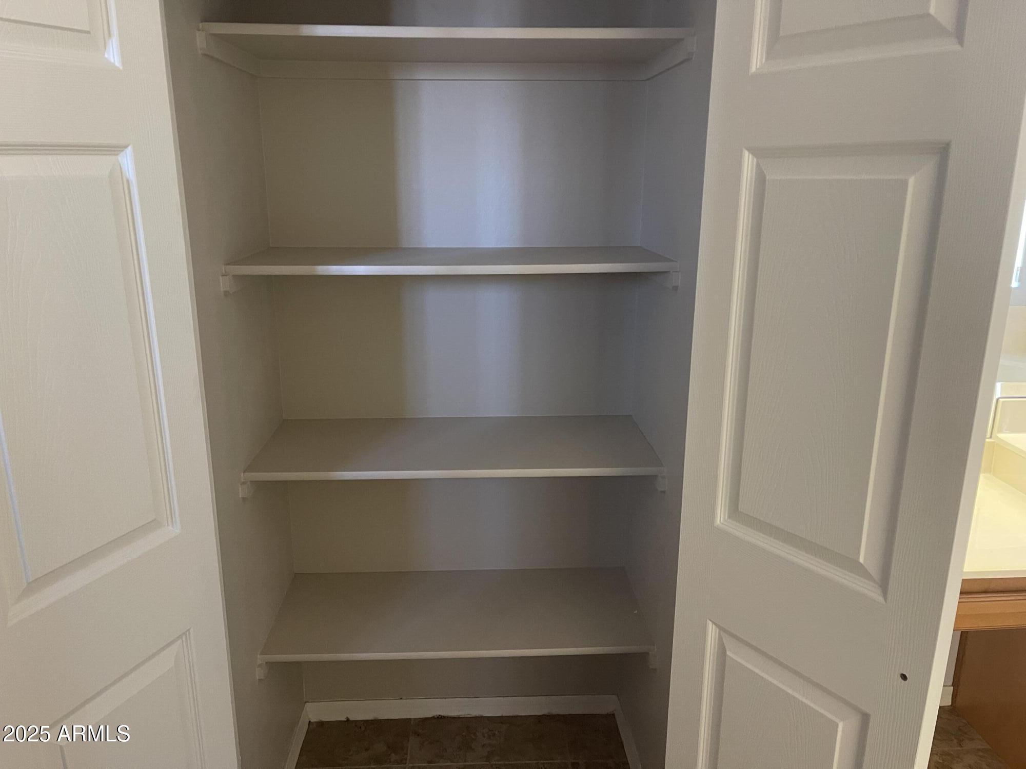 51355 West Century Road Maricopa, AZ 85139 - Photo 18 of 33 a view of an empty walk in closet