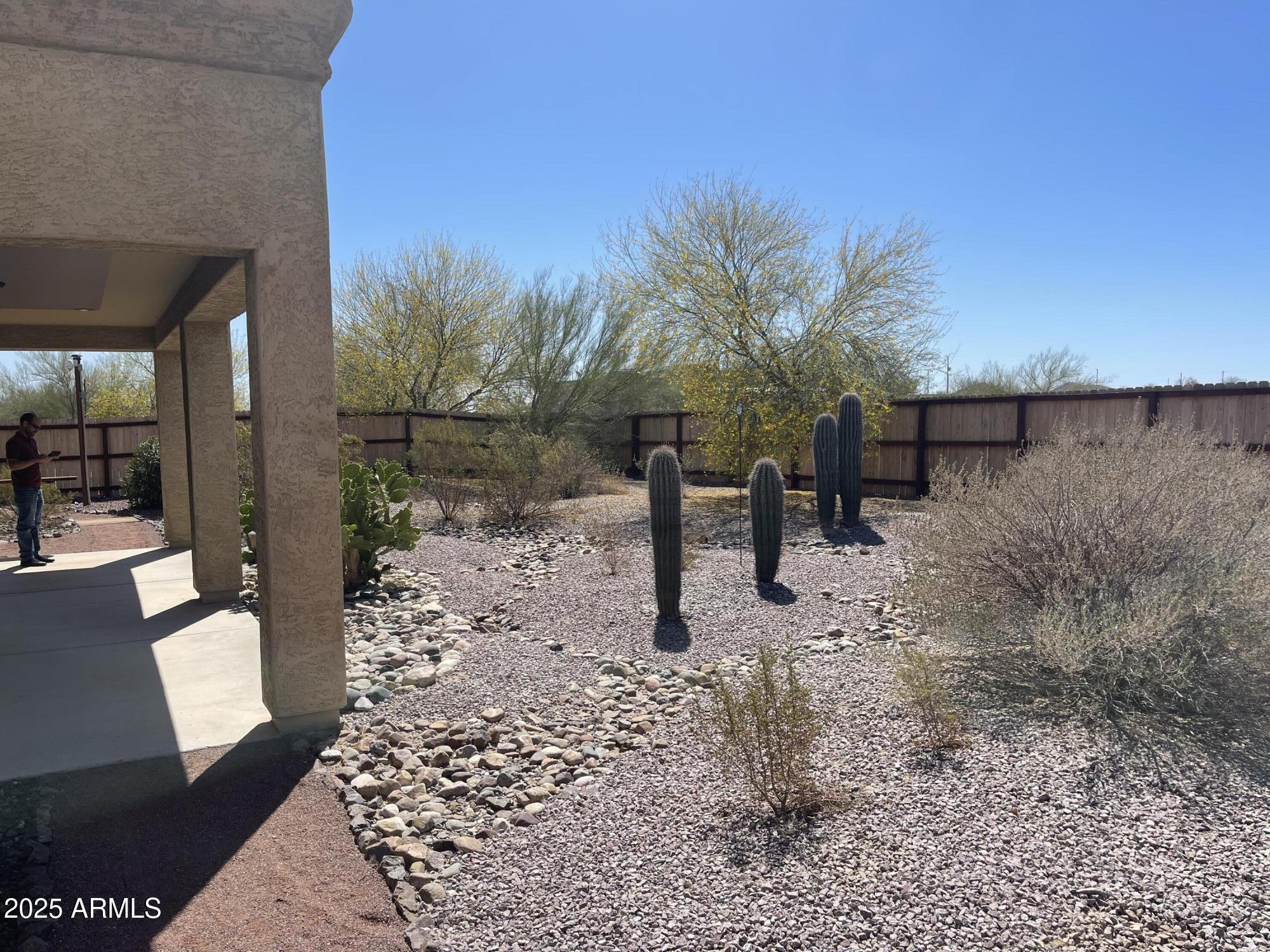 51355 West Century Road Maricopa, AZ 85139 - Photo 21 of 33 a view of a yard with a slide