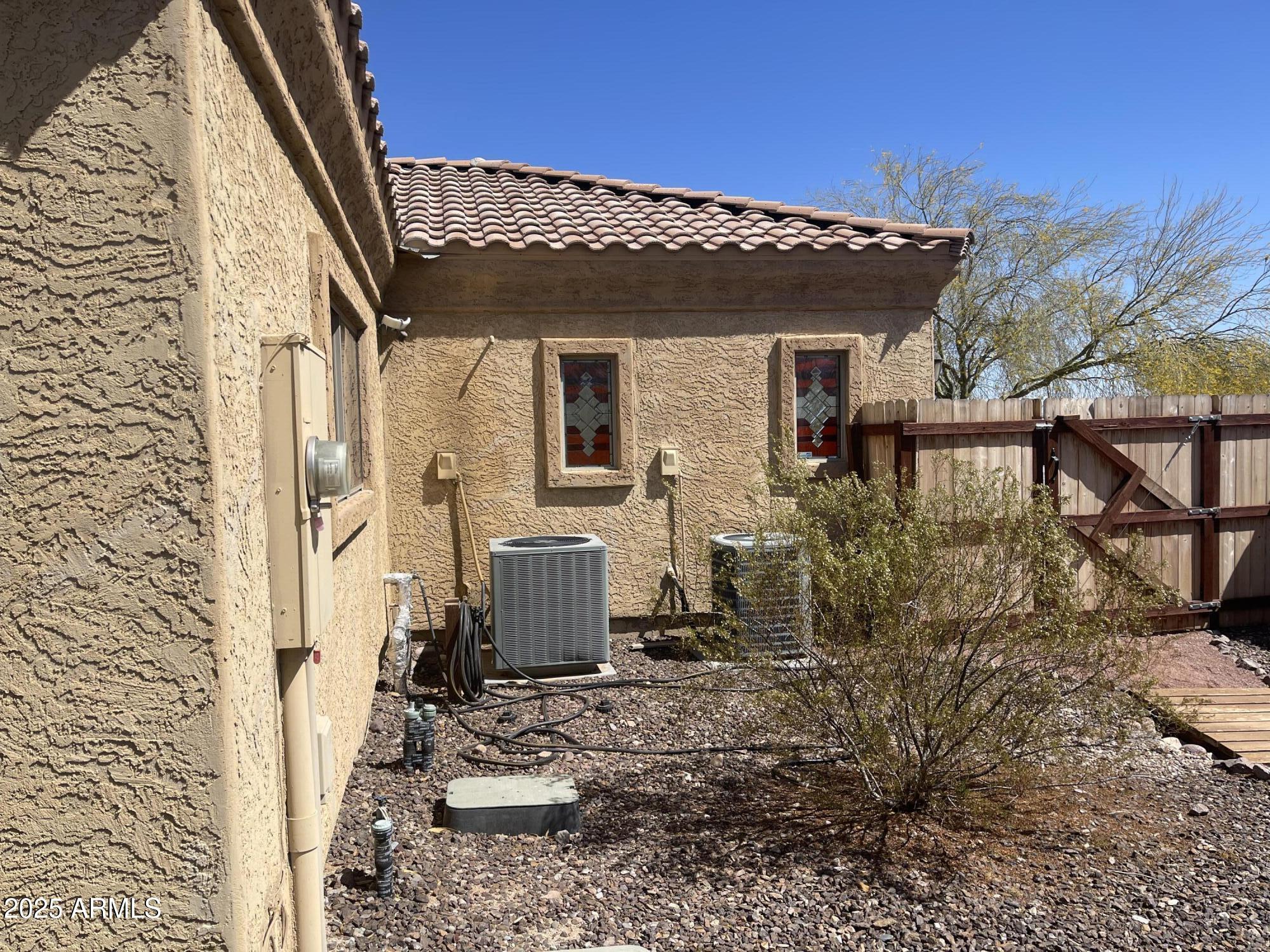 51355 West Century Road Maricopa, AZ 85139 - Photo 24 of 33 a view of a house with backyard and sitting area