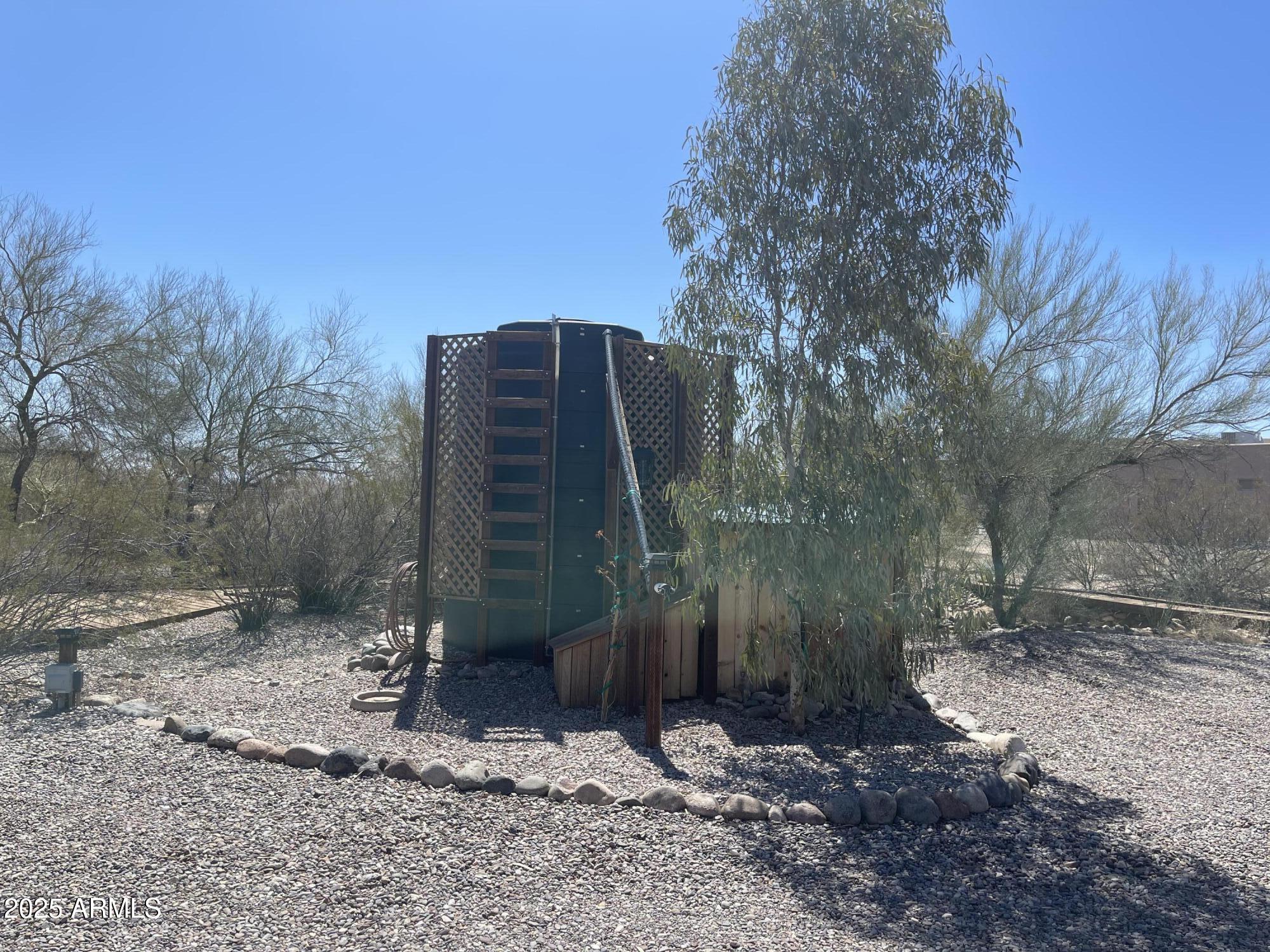 51355 West Century Road Maricopa, AZ 85139 - Photo 31 of 33 a backyard of a house with lots of green space