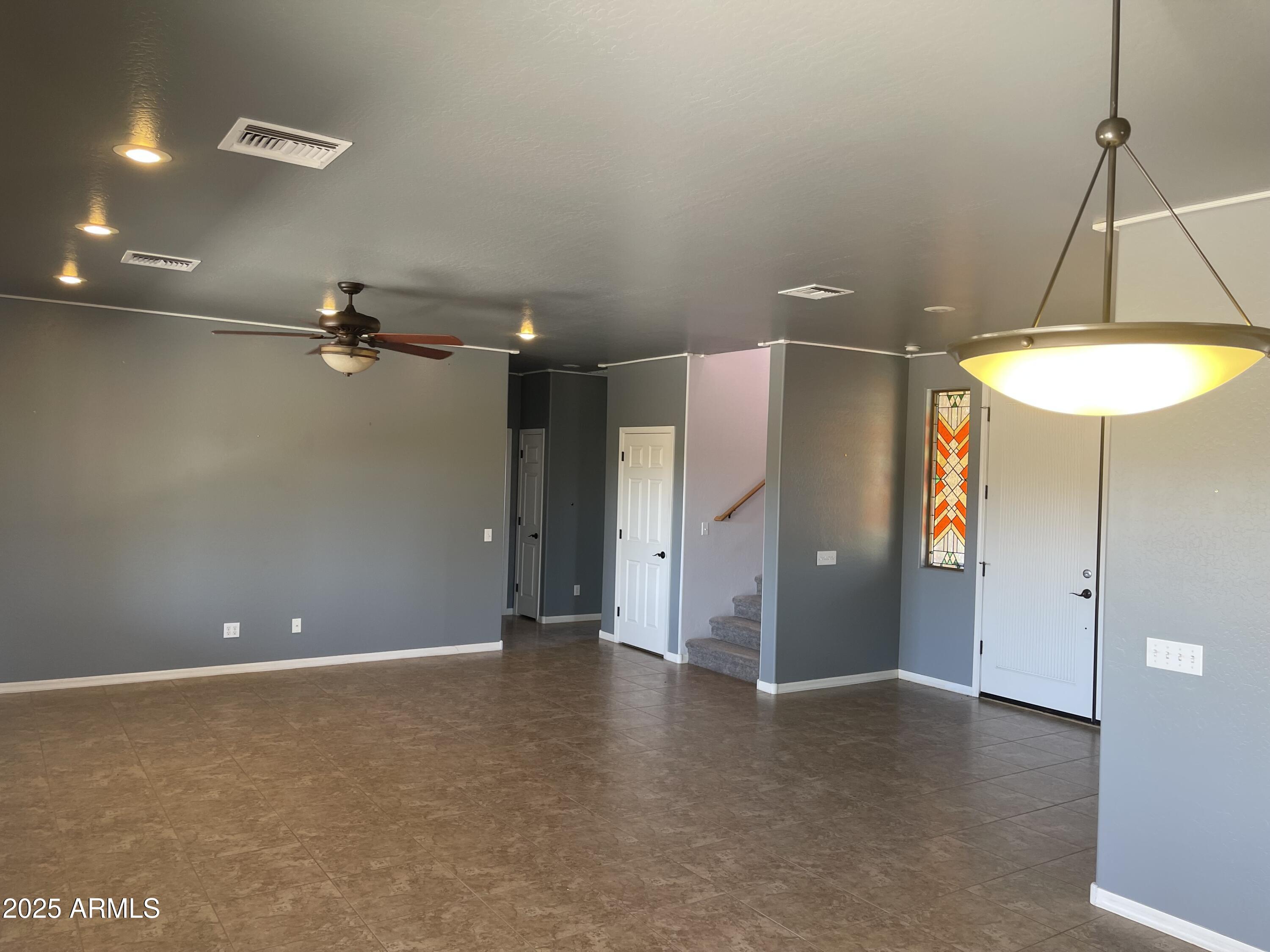 51355 West Century Road Maricopa, AZ 85139 - Photo 6 of 33 an empty room with a fan