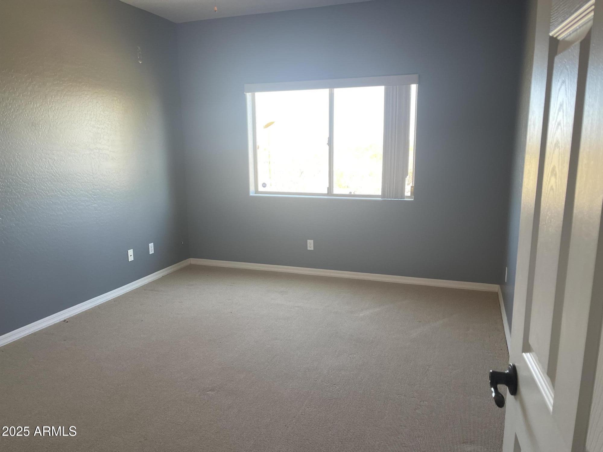 51355 West Century Road Maricopa, AZ 85139 - Photo 8 of 33 an empty room with a window