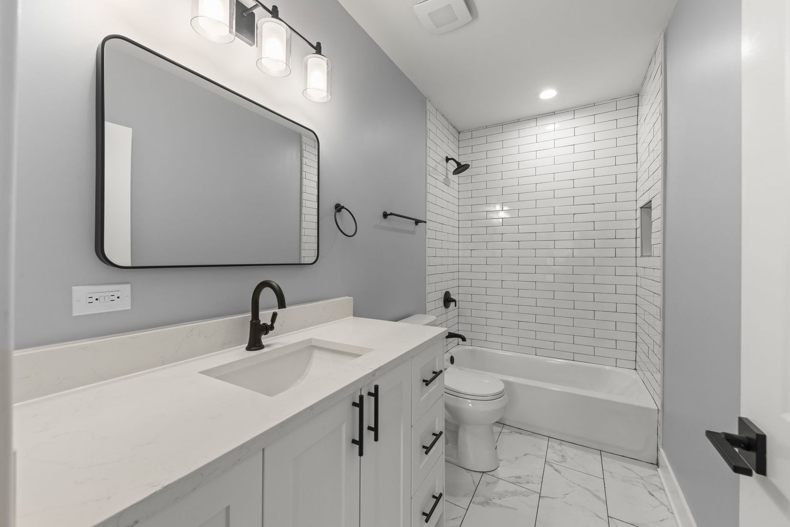 7600 West 60th Street Summit, IL 60501 - Photo 17 of 22 a bathroom with a sink a toilet and shower