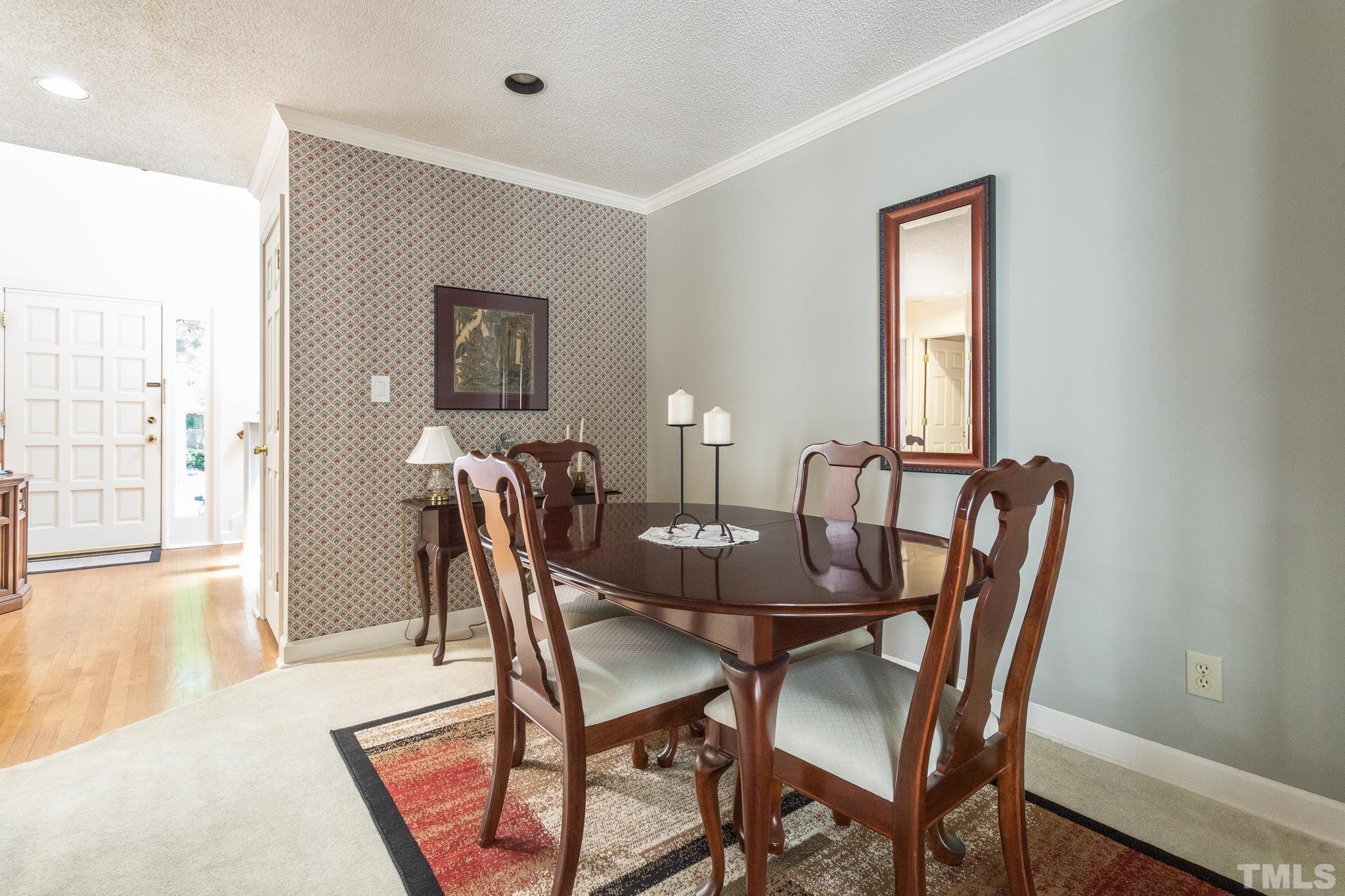 9 Pinnacle Road Durham, NC 27705 - Photo 5 of 25 a view of a dining room with furniture and wooden floor