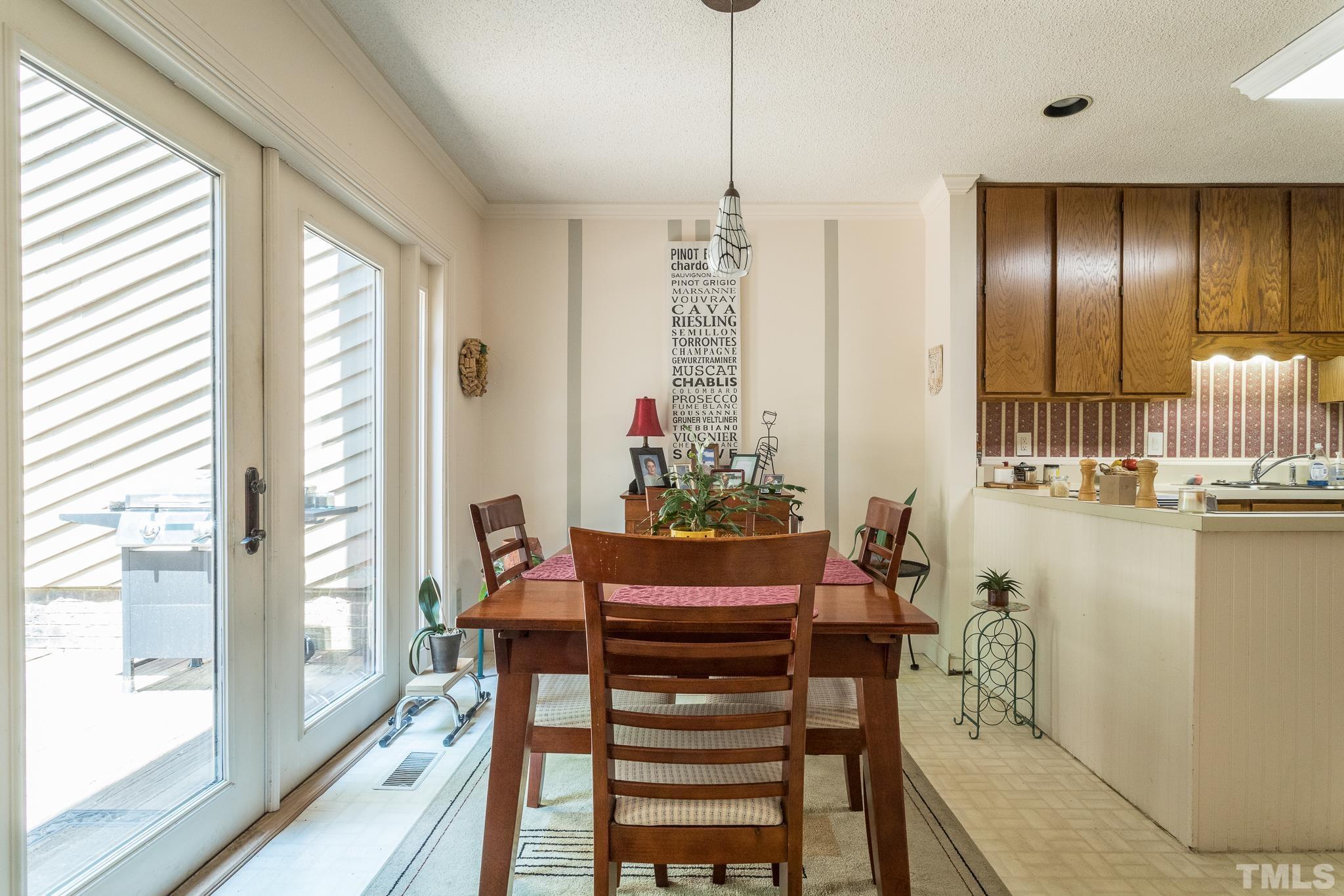 9 Pinnacle Road Durham, NC 27705 - Photo 10 of 25 a view of a dining room with furniture window and outside view