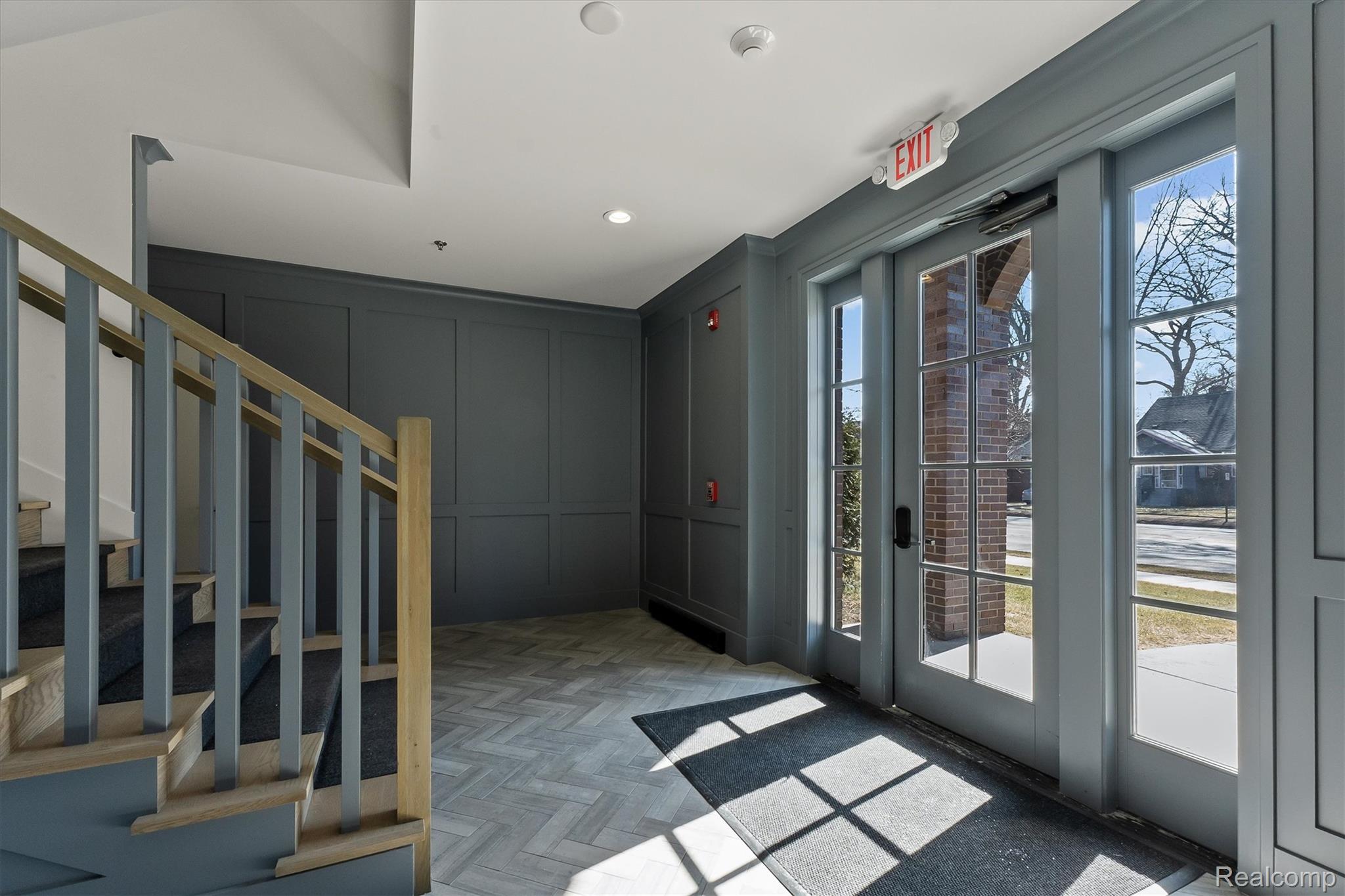 936 West Eleven Mile Road Royal Oak, MI 48067 - Photo 2 of 19 Entryway with a decorative wall, parquet floors, and recessed lighting