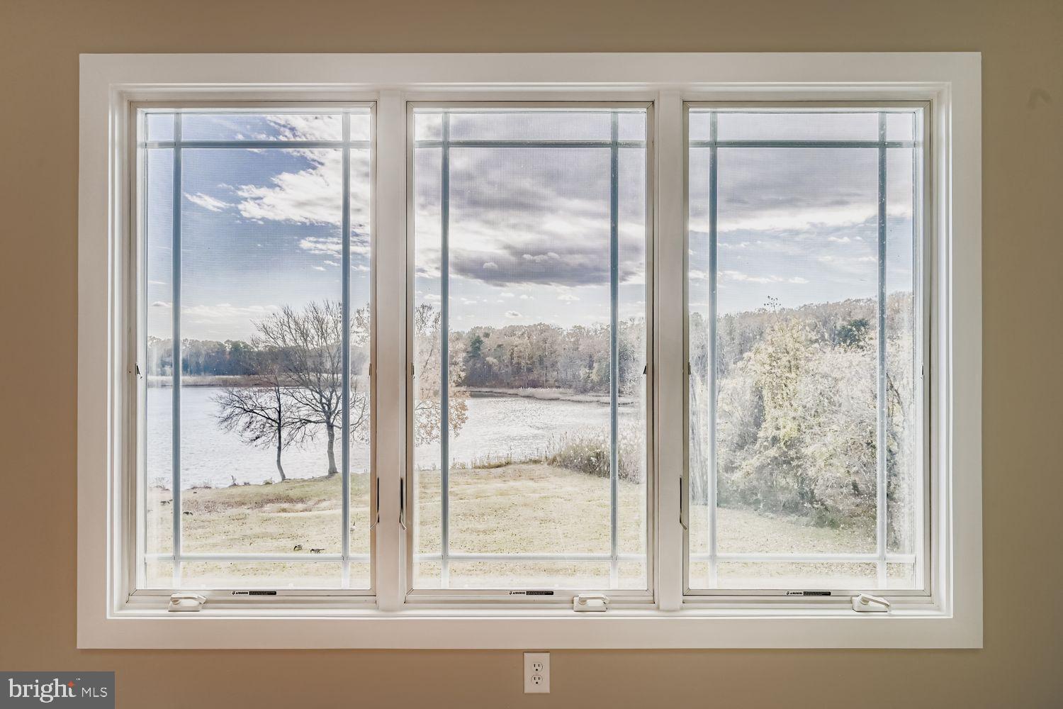 1419 Pond Ridge Drive Pasadena, MD 21122 - Photo 20 of 49 Tranquil lake view through expansive windows.