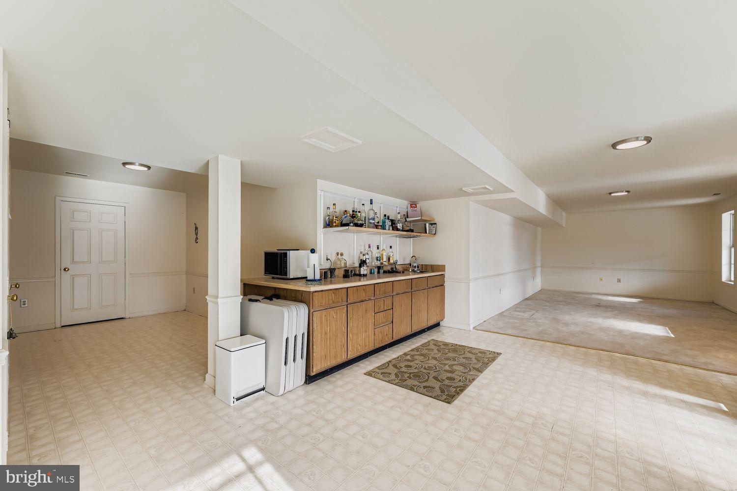 1419 Pond Ridge Drive Pasadena, MD 21122 - Photo 28 of 49 Spacious, versatile room with bar area.