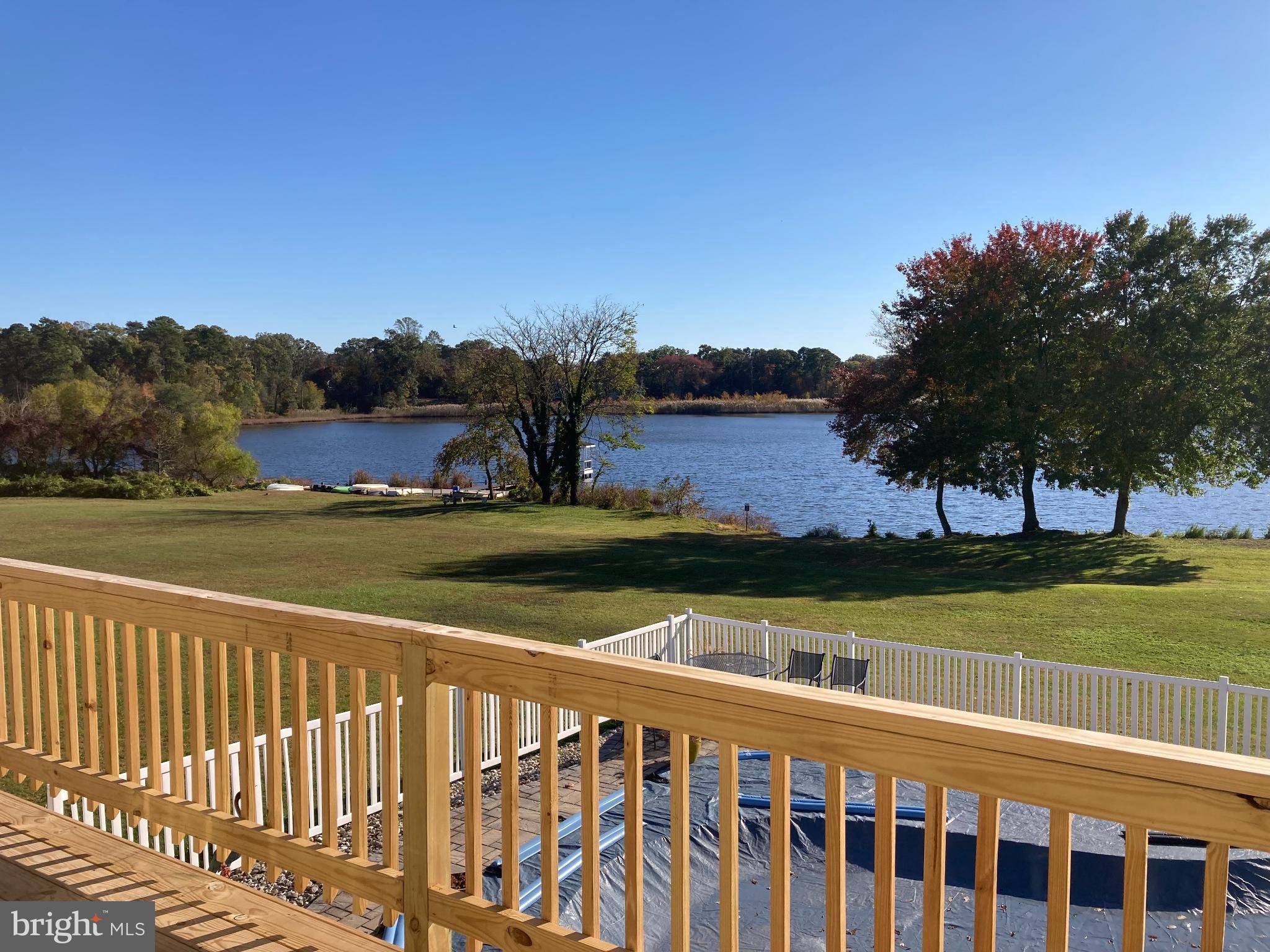 1419 Pond Ridge Drive Pasadena, MD 21122 - Photo 37 of 49 Serene lakeside view from a welcoming deck.