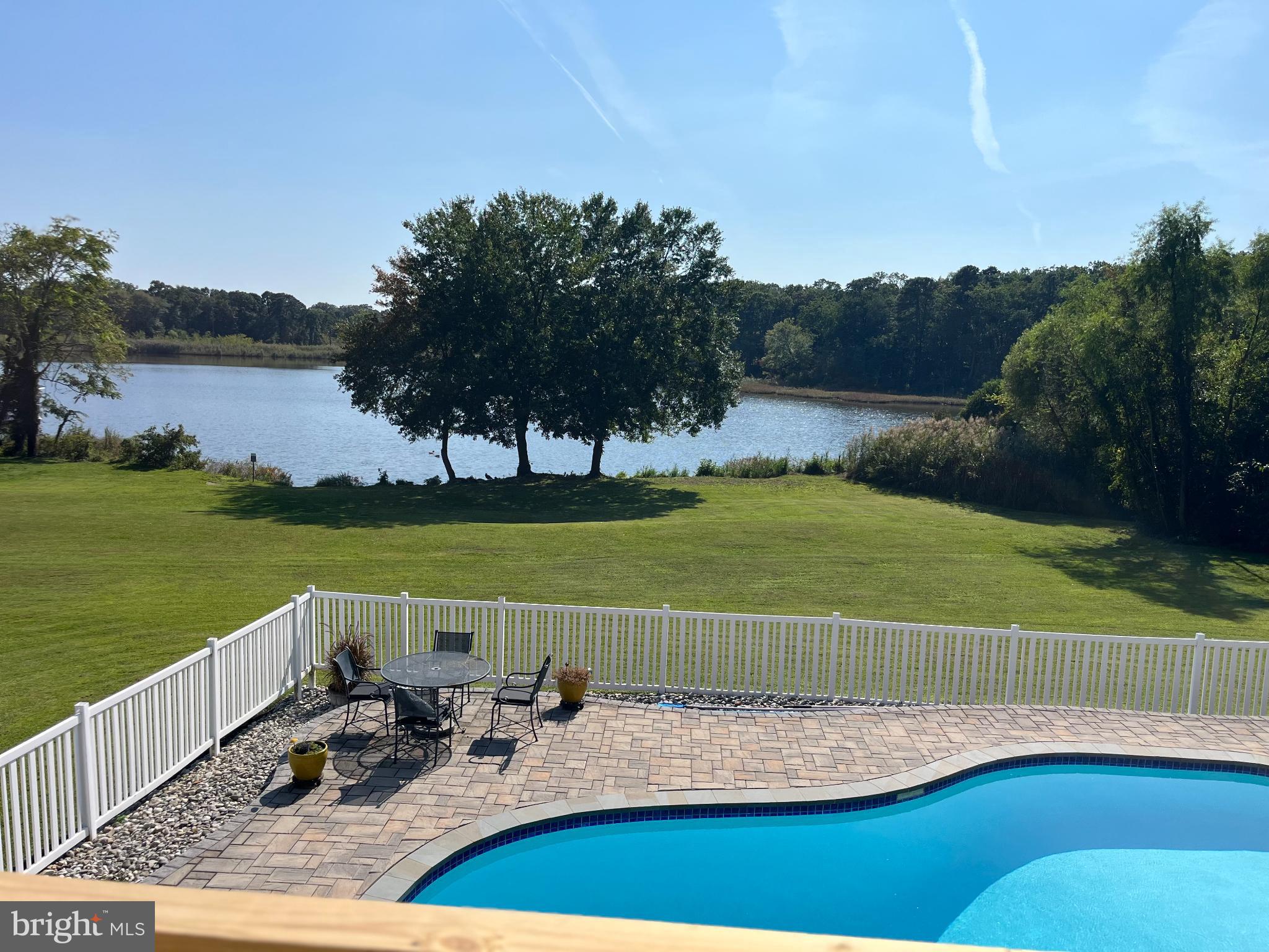 1419 Pond Ridge Drive Pasadena, MD 21122 - Photo 38 of 49 Serene lakeside retreat with poolside views.