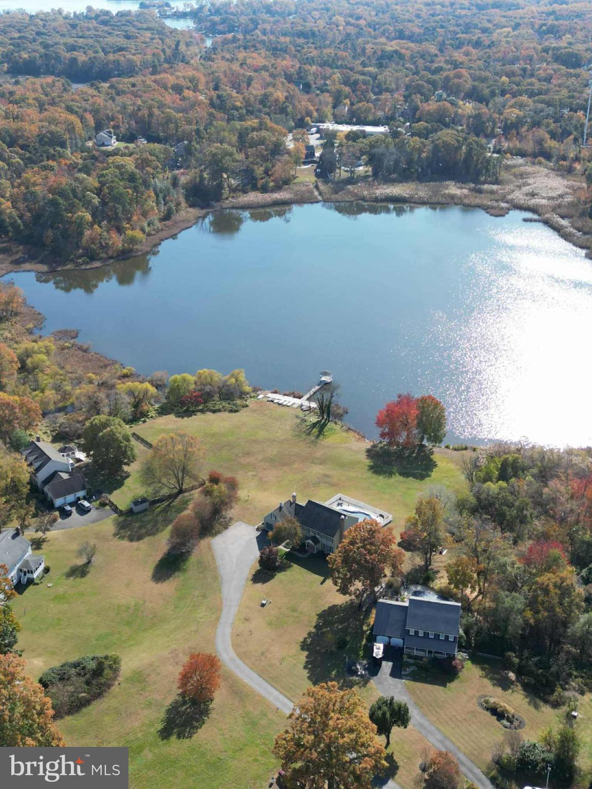 1419 Pond Ridge Drive Pasadena, MD 21122 - Photo 42 of 49 Serene lakeside retreat in autumn hues.