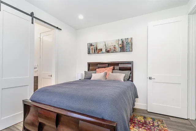 a bedroom with a bed and a table