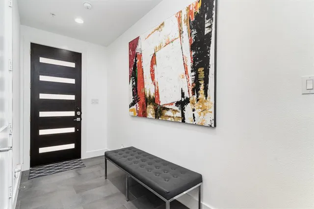 a view of a hallway with paintings on the wall