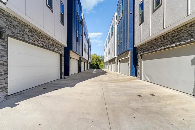 a view of a white apartments with large windows