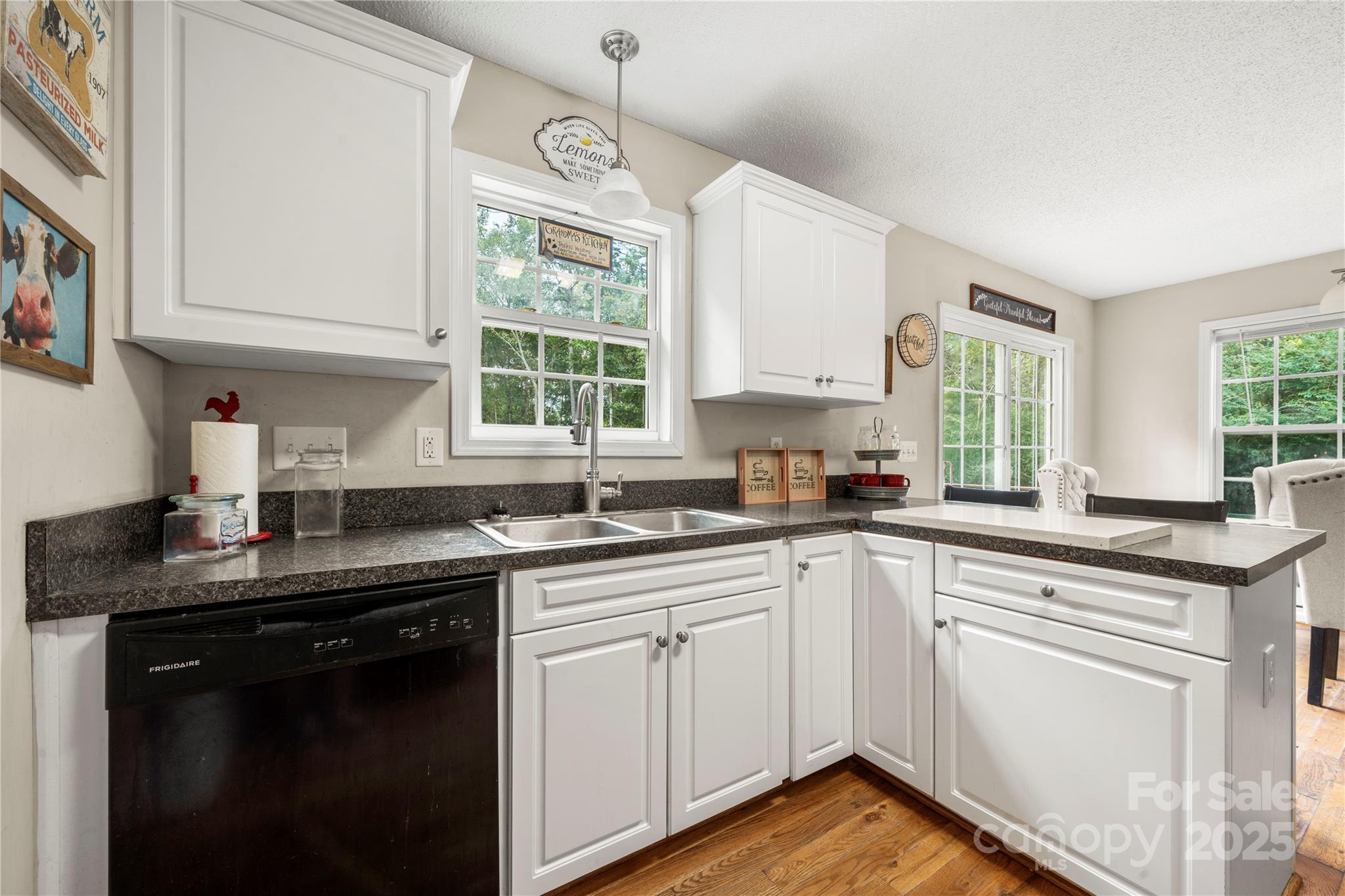 2430 Dr Nichols Road York, SC 29745 - Photo 16 of 26 a kitchen with cabinets appliances a sink and a window