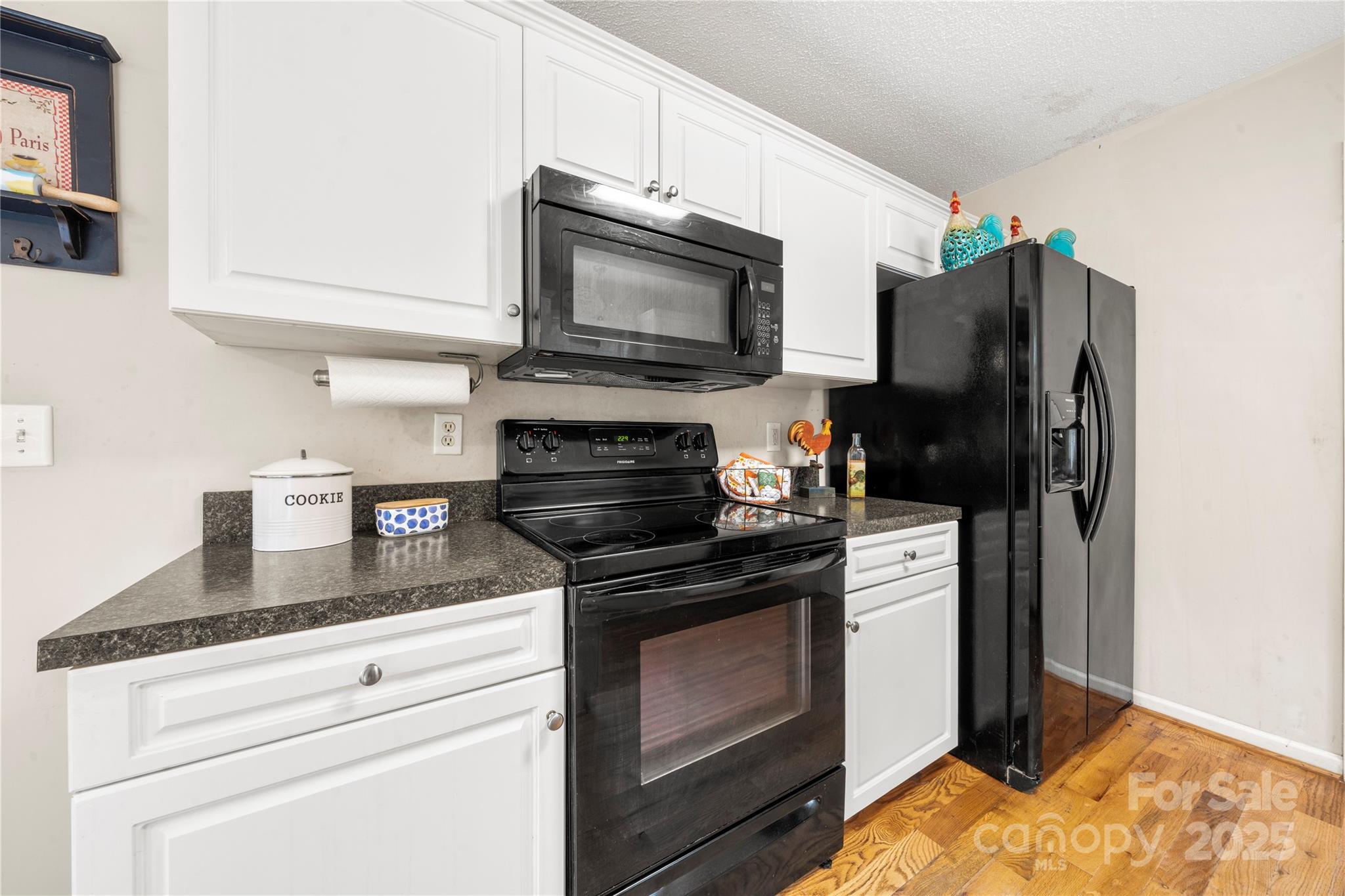 2430 Dr Nichols Road York, SC 29745 - Photo 17 of 26 a kitchen with granite countertop a stove and a microwave