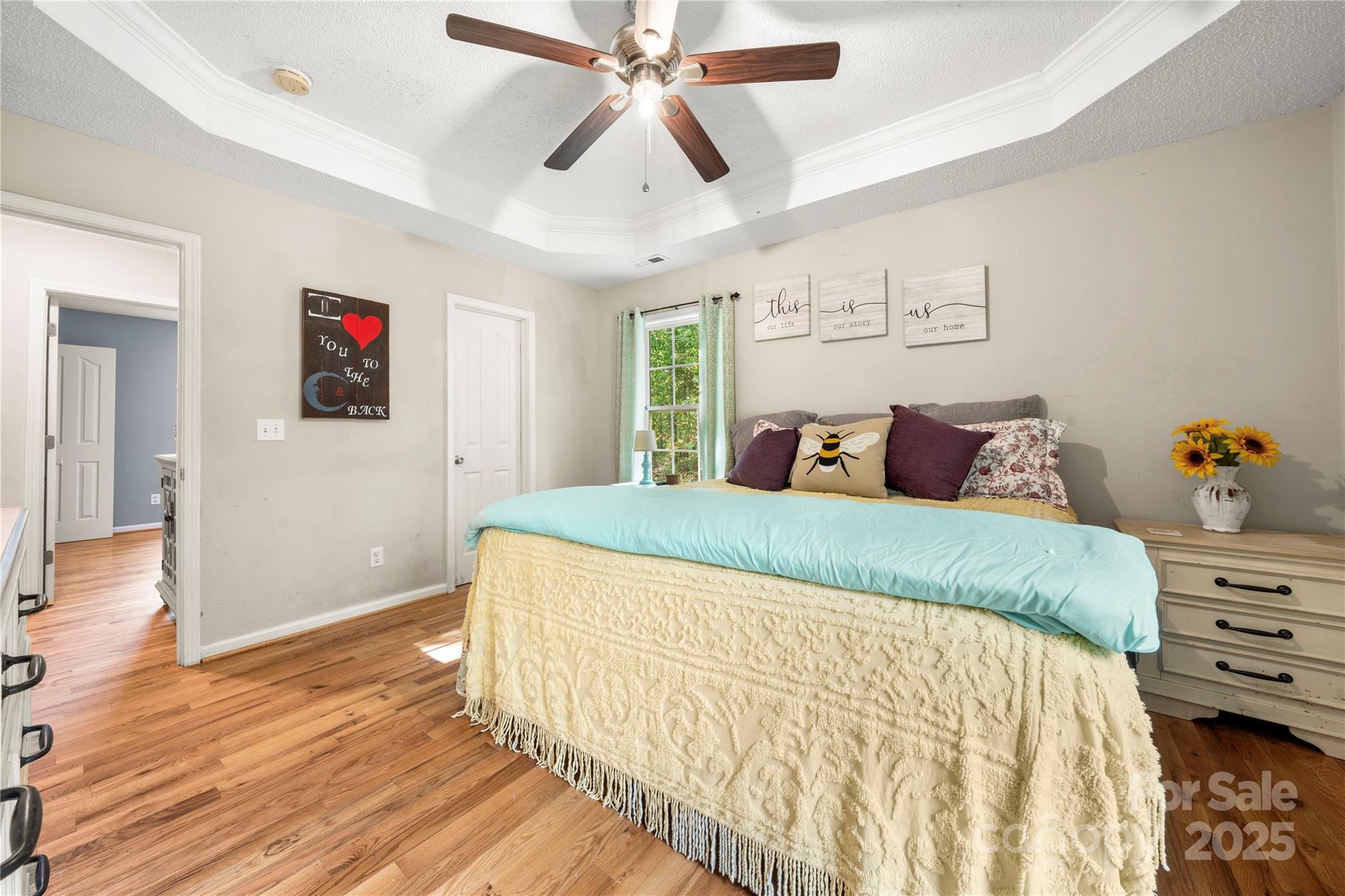 2430 Dr Nichols Road York, SC 29745 - Photo 23 of 26 a bedroom with a large bed and a chandelier