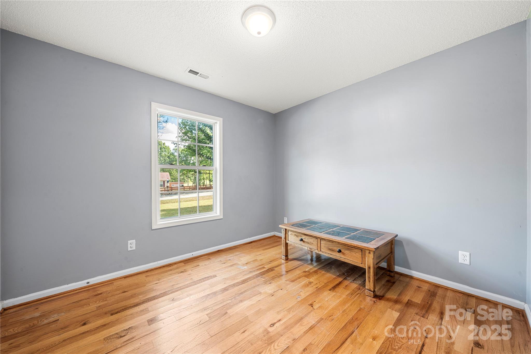 2430 Dr Nichols Road York, SC 29745 - Photo 25 of 26 a room with a window and wooden floor