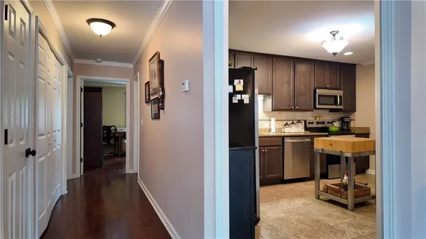a view of a kitchen from the hallway