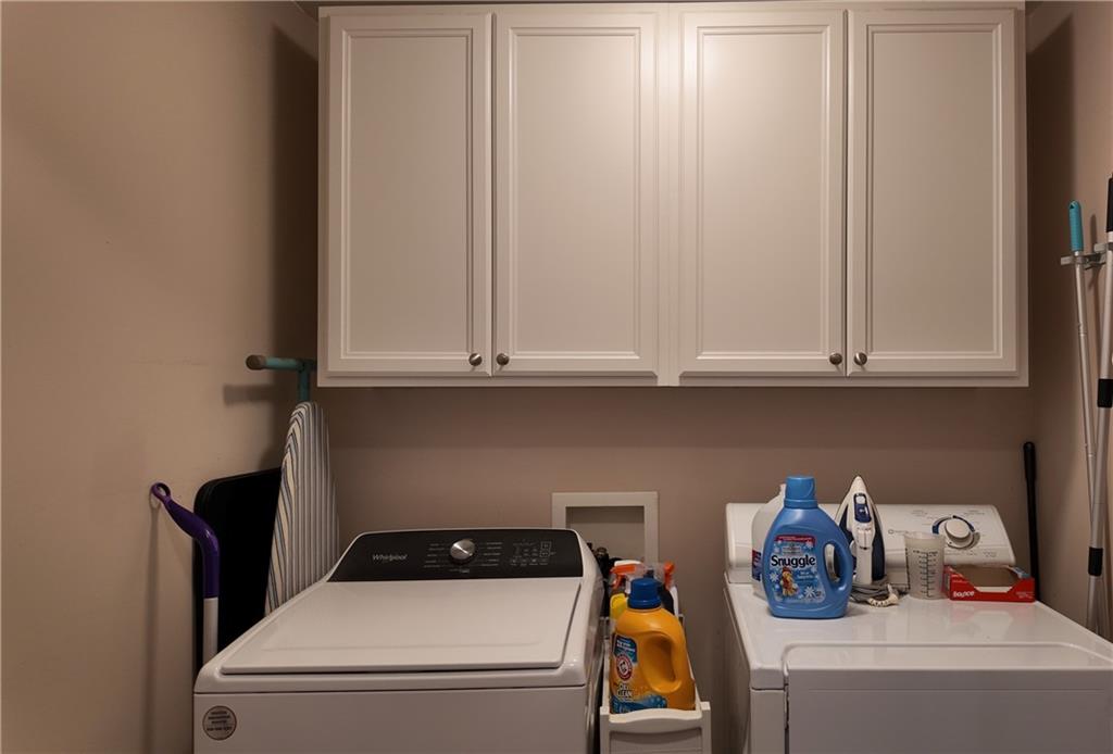 115 Old Mill Drive Calhoun, GA 30701 - Photo 16 of 39 a utility room with dryer and washer