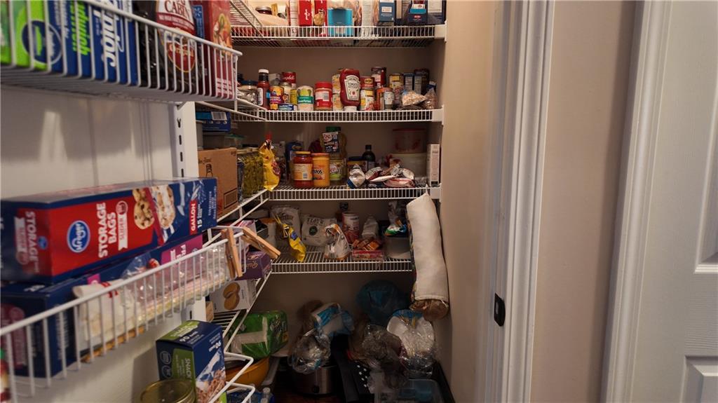 115 Old Mill Drive Calhoun, GA 30701 - Photo 17 of 39 a room with lots of different colored cloths