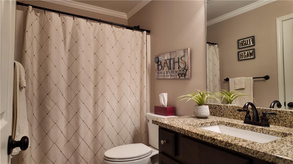 115 Old Mill Drive Calhoun, GA 30701 - Photo 19 of 39 a bathroom with a granite countertop sink and a mirror