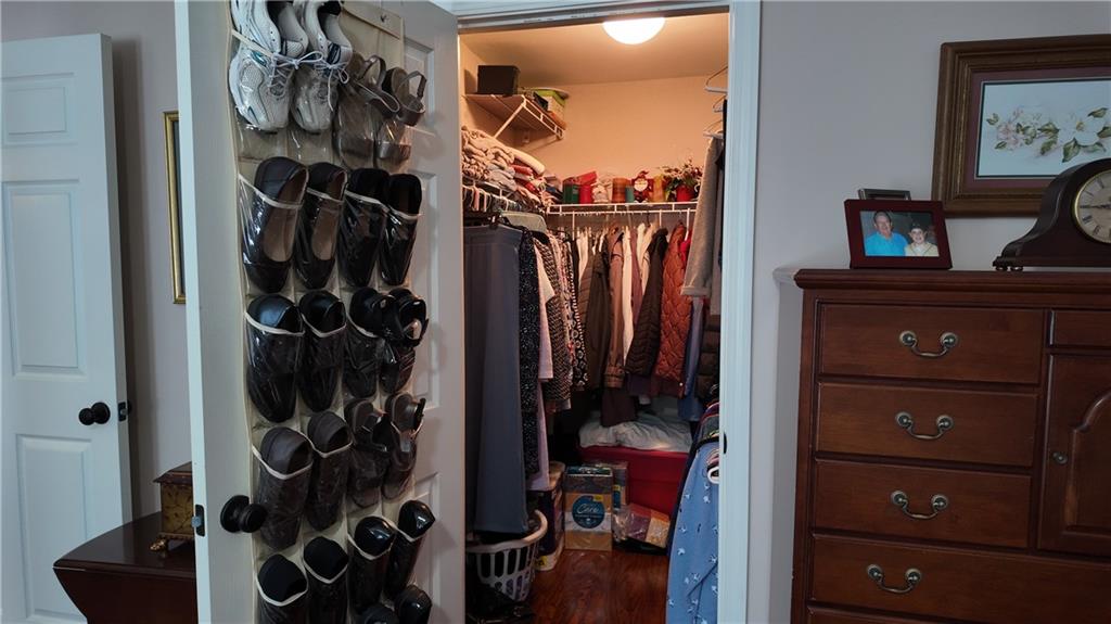 115 Old Mill Drive Calhoun, GA 30701 - Photo 24 of 39 a view of walk in closet with clothes and shoes