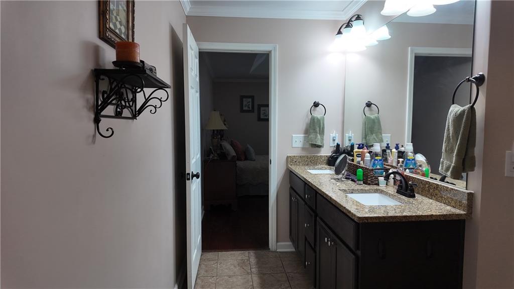 115 Old Mill Drive Calhoun, GA 30701 - Photo 27 of 39 a bathroom with a sink and a mirror