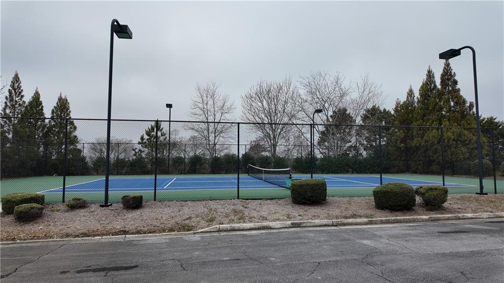 115 Old Mill Drive Calhoun, GA 30701 - Photo 37 of 39 a view of a terrace with a basket ball court