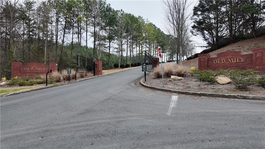 115 Old Mill Drive Calhoun, GA 30701 - Photo 39 of 39 a backyard of a house with trees and outdoor seating