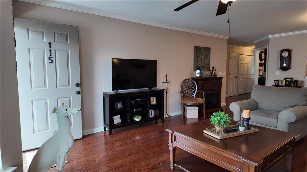 115 Old Mill Drive Calhoun, GA 30701 - Photo 9 of 39 a living room with furniture and a flat screen tv