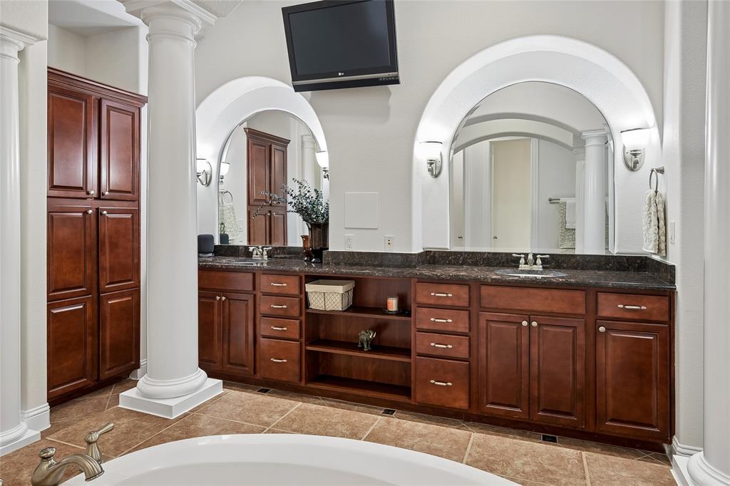 835 Rockingham Drive Irving, TX 75063 - Photo 18 of 30 The vanity area is beautifully illuminated and provides plenty of cabinets.