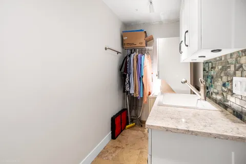 a view of a hallway view with three rooms