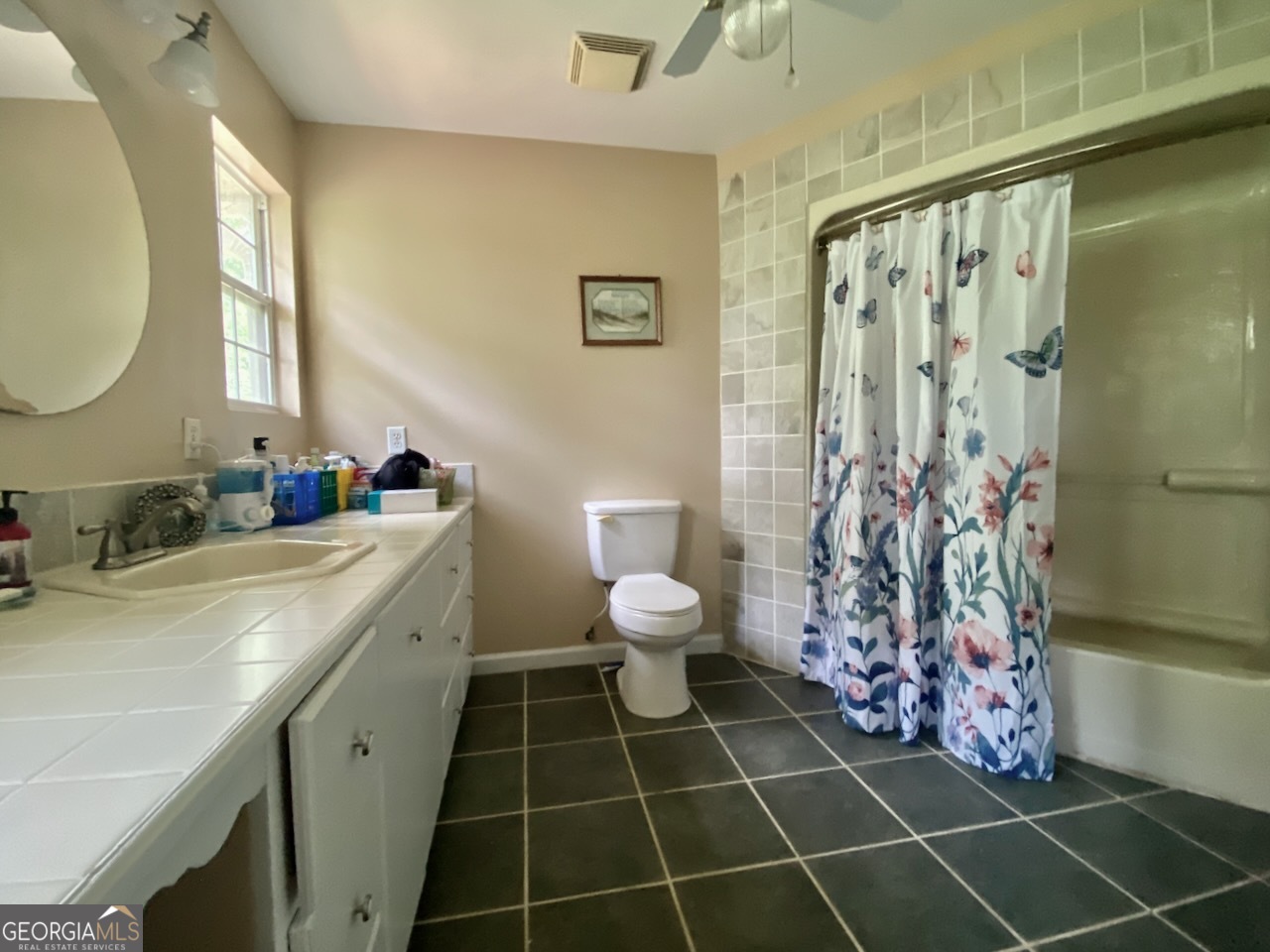293 Osage Circle Byron, GA 31008 - Photo 13 of 31 a bathroom with a sink toilet and shower