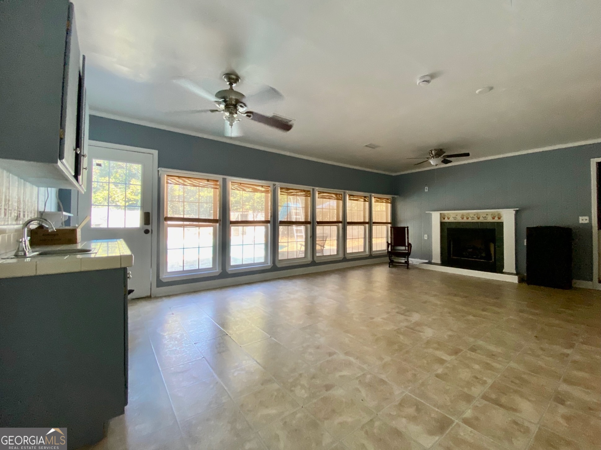 293 Osage Circle Byron, GA 31008 - Photo 14 of 31 a view of an empty room with a fireplace and a window