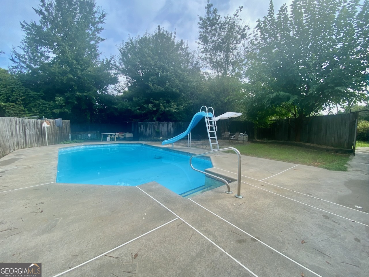 293 Osage Circle Byron, GA 31008 - Photo 17 of 31 a swimming pool with a outdoor seating and yard