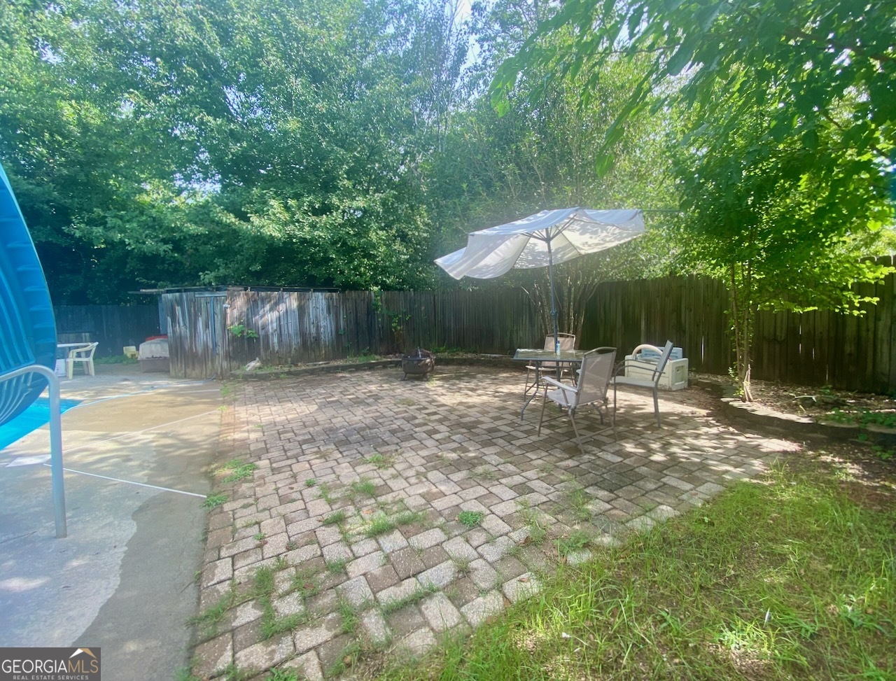 293 Osage Circle Byron, GA 31008 - Photo 18 of 31 a backyard of a house with table and chairs