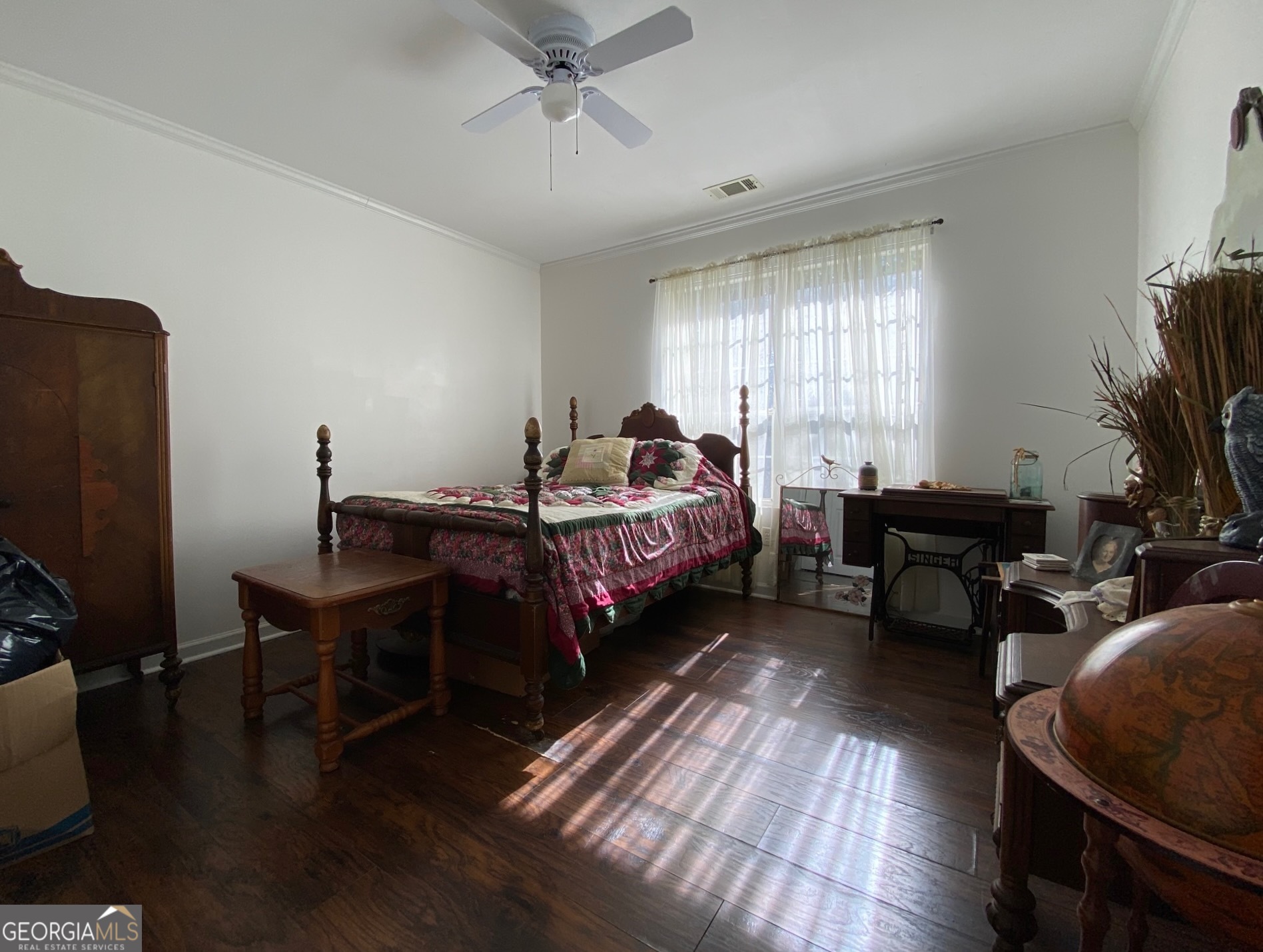 293 Osage Circle Byron, GA 31008 - Photo 24 of 31 a bedroom with bed a flat tv screen and a dresser