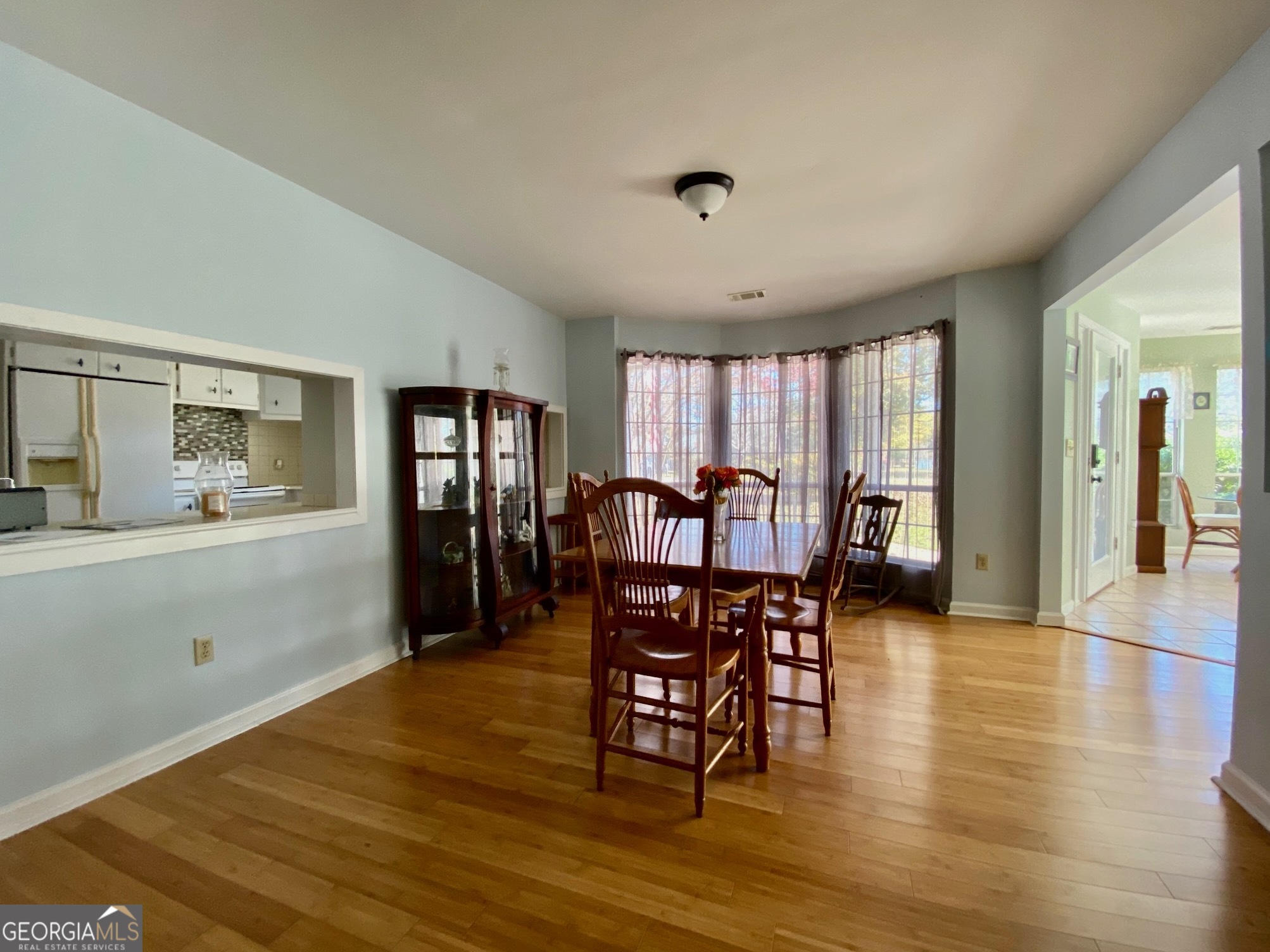 293 Osage Circle Byron, GA 31008 - Photo 7 of 31 a view of a dining room with furniture and wooden floor