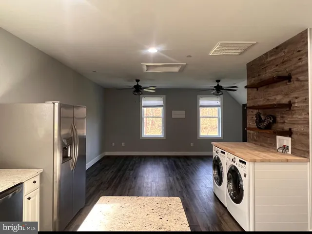 a utility room with closet dryer and washer