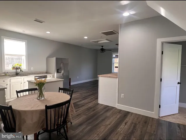 a kitchen with a table and chairs in it